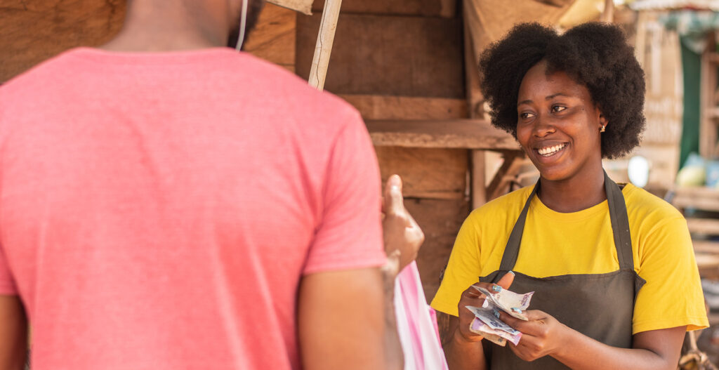 african woman and man bargaining in a market